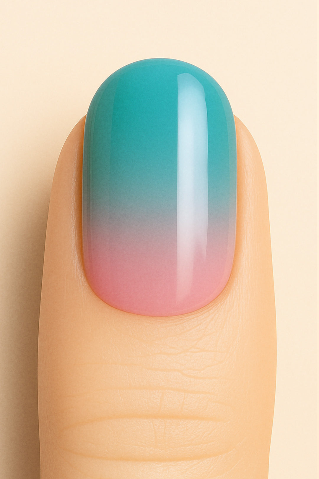 A close-up of a model’s finger wearing Ocean Sunset Ombre Nail Stickies, blending soft pink at the base into a serene teal blue at the tip, capturing a smooth glossy gradient that mirrors a tropical sunset sky – Muselot.