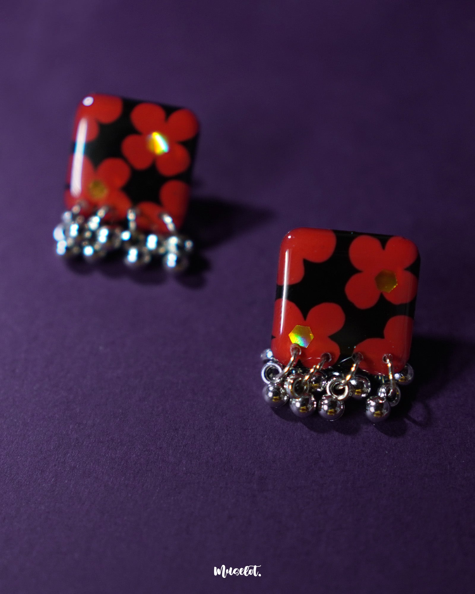 A beautifully crafted pair of Raktphool stud earrings, featuring delicate floral patterns that exude elegance and sophistication, making them the ideal choice for any special occasion — Muselot.