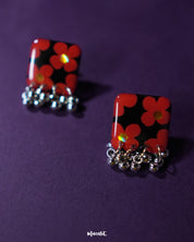 A beautifully crafted pair of Raktphool stud earrings, featuring delicate floral patterns that exude elegance and sophistication, making them the ideal choice for any special occasion — Muselot.
