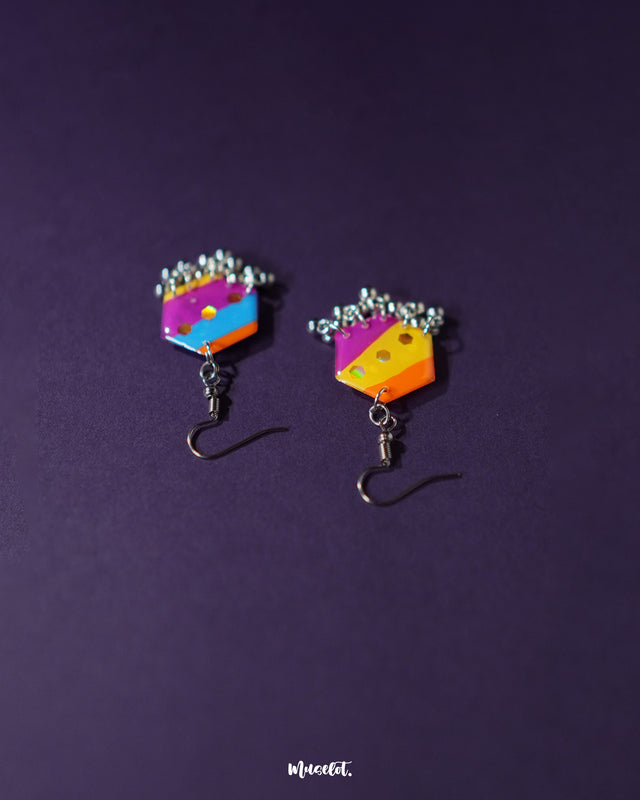 Rangbahaar colorful hook earrings displayed upright, flaunting their handcrafted detailing with vivid threadwork, tiny mirror embellishments, and hanging silver-toned beads that reflect boho elegance — Muselot.