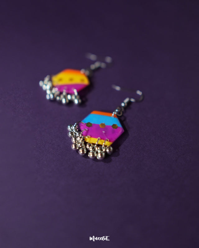 Rangbahaar colorful hook earrings displayed from a top angle, revealing the layered textures of thread embroidery, small mirrors, and dangling beads in a festive, handcrafted design — Muselot.