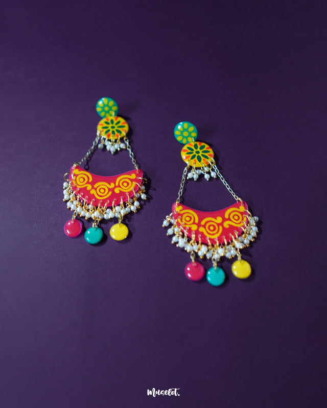 Delicately crafted with vibrant enamel hues and intricate detailing, the Rangsiya colorful chandbali earrings exude festive charm and timeless elegance, making them a standout accessory for ethnic ensembles — Muselot.