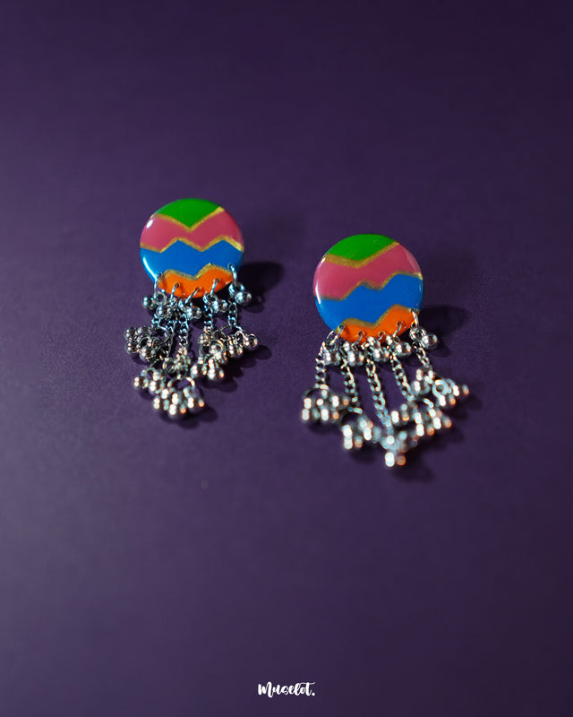 Rangtarang colorful long chain earrings featuring a striking vertical layout of vivid hand-painted motifs, flowing into silver-toned chains that add length and movement, perfect for making a bold statement with a dash of artistic flair – Muselot.