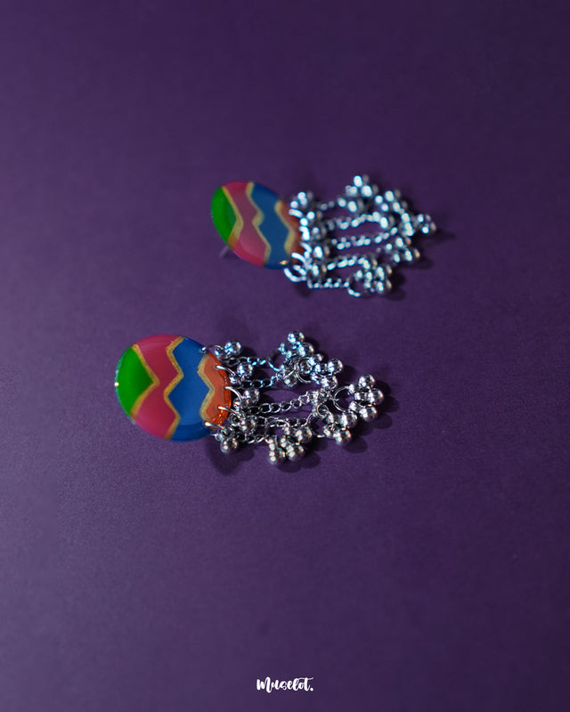 A side view of the Rangtarang colorful long chain earrings showcasing their cascading layers of handcrafted beads and enamel work in vivid shades, capturing a joyful and bohemian spirit – Muselot.