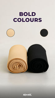 Rolled pairs of premium Muselot stockings in skin and black color placed side by side on a soft gray surface. The words "Bold Colours" appear above in dark purple, with circular swatches of each color beside the text. A clean, minimal studio shot that highlights color options.

