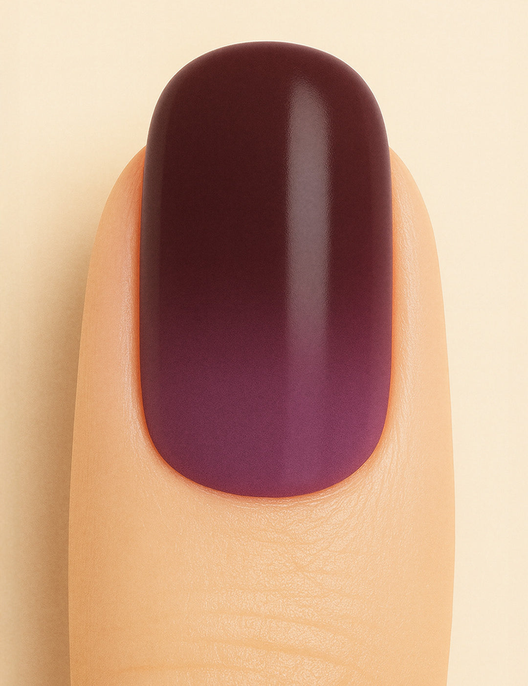 A close-up shot of a model’s finger featuring Rosewood Ombre Nail Stickies, showcasing a smooth gradient blending deep brown into rich plum tones, highlighting the bold yet elegant finish of ombre nail art with a glossy sheen – Muselot.