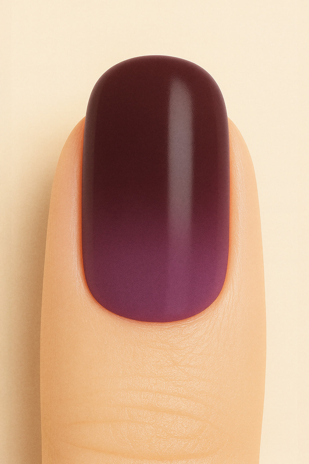 A close-up shot of a model’s finger featuring Rosewood Ombre Nail Stickies, showcasing a smooth gradient blending deep brown into rich plum tones, highlighting the bold yet elegant finish of ombre nail art with a glossy sheen – Muselot.