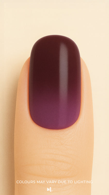 A close-up shot of a model’s finger featuring Rosewood Ombre Nail Stickies, showcasing a smooth gradient blending deep brown into rich plum tones, highlighting the bold yet elegant finish of ombre nail art with a glossy sheen – Muselot.