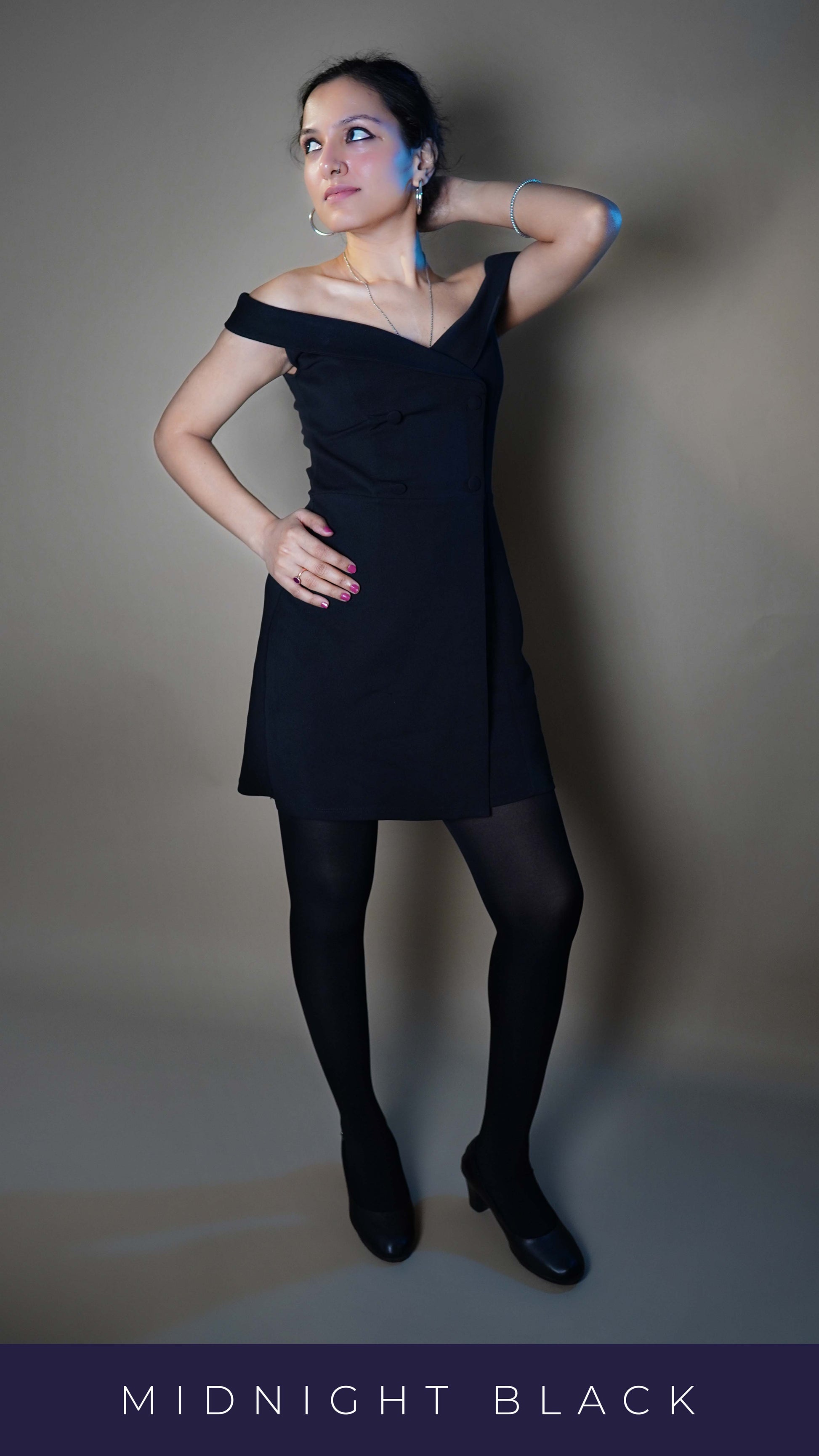 A woman wearing comfortable tear proof stockings, posing with her hand up behind her head and other on her waist as she looks sideways, highlighting the perfect trendy fit-Muselot