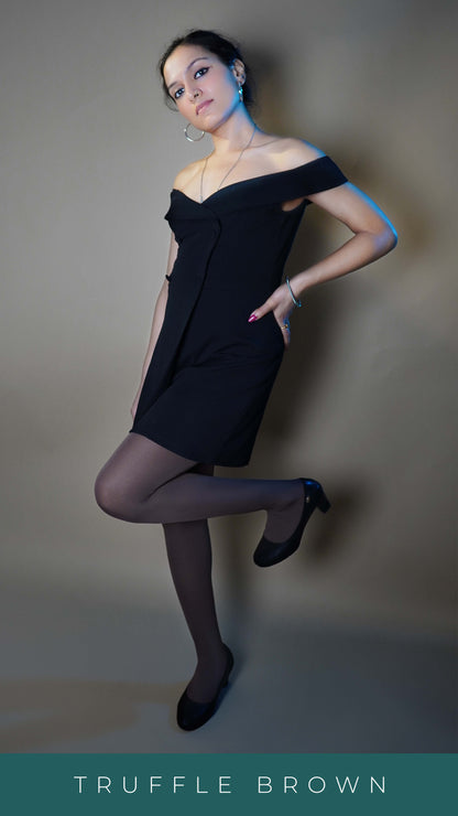 A woman wearing girl's dark brown tear resistant tights, posing with her hand on her waist as she stands slightly sideways, showcasing a stylish modern look-Muselot