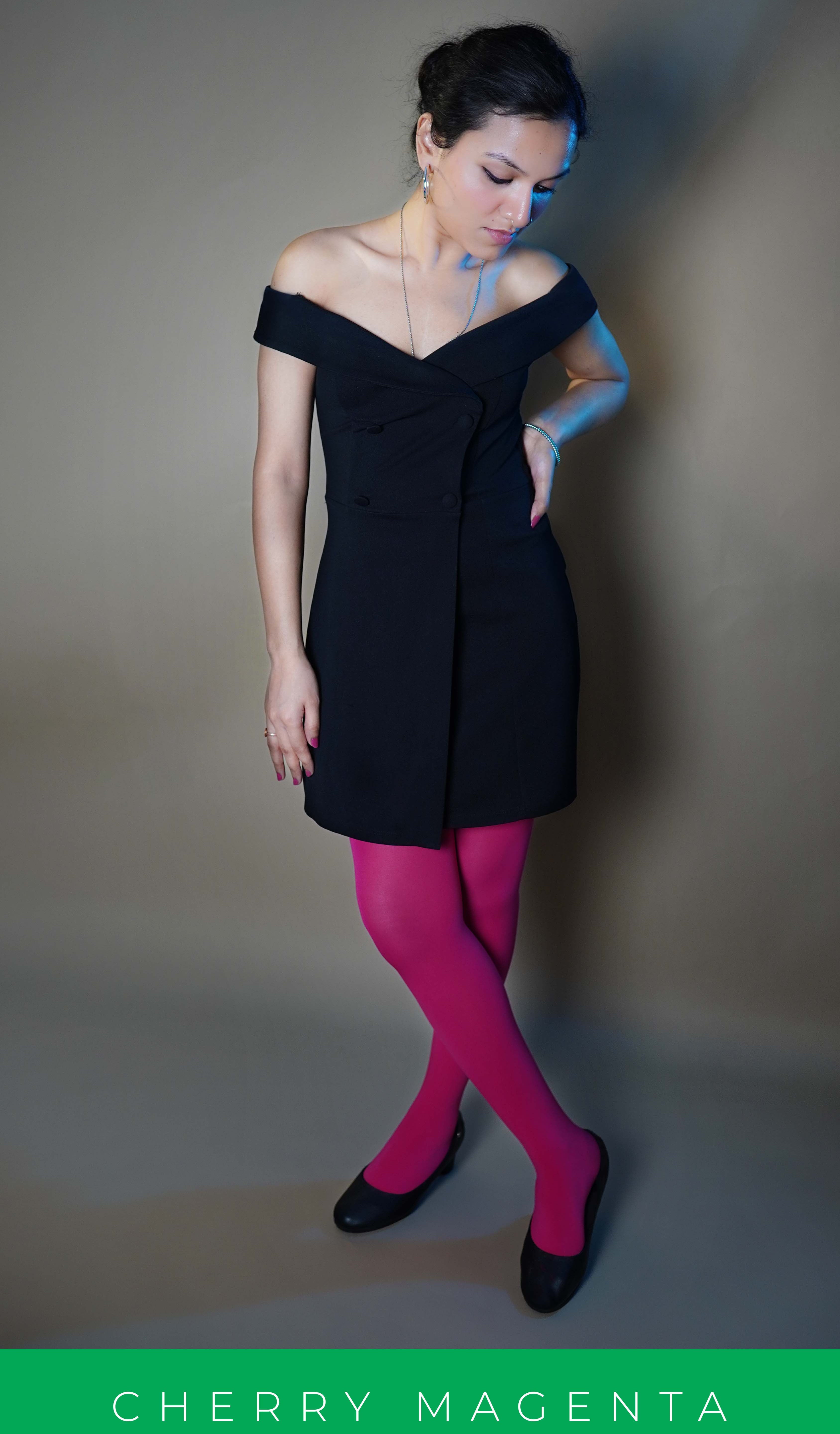 A woman wearing hot pink plus size stockings, posing with her hand on her waist and other hanging at her side, showcasing the voguish stylish look-Muselot