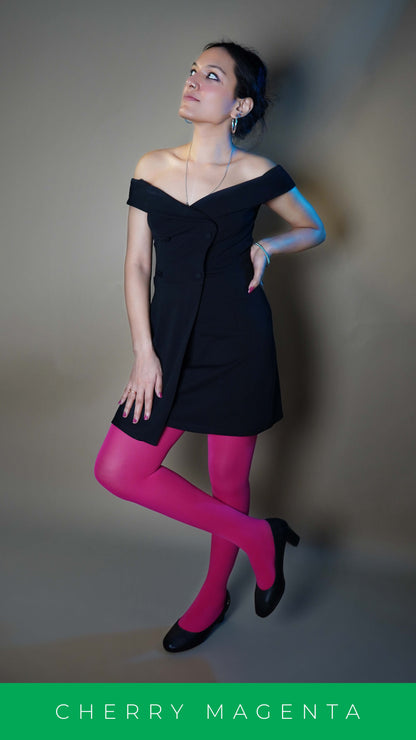 A woman wearing stretchable hot pink semi opaque pantyhose, posing with her hand on her waist as her head is slightly upward, showcasing the comfortable tear proof material-Muselot