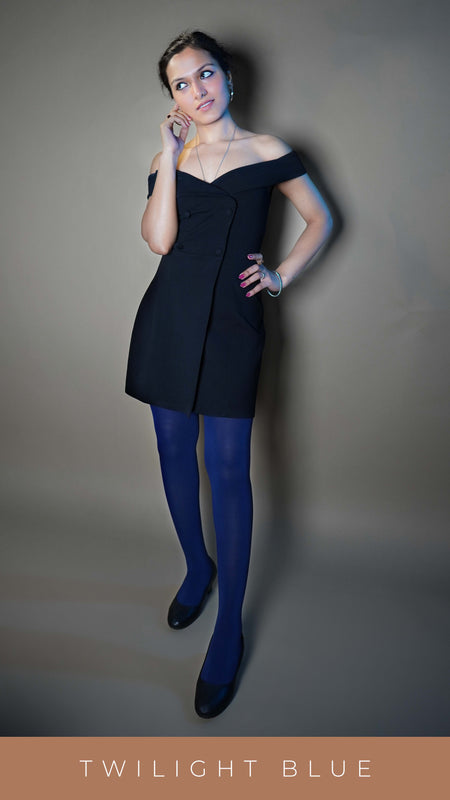 A model wearing navy blue semi opaque tear proof pantyhose, posing with her hand on her waist and other touching her lower ear as she smiles sweetly looking sideways, showcasing the bright in vogue look-Muselot