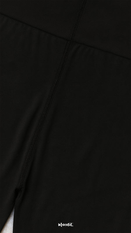 Close-up of semi-opaque black tights fabric with reinforced stitching, showcasing durability, smooth texture, and high-quality finish - Muselot