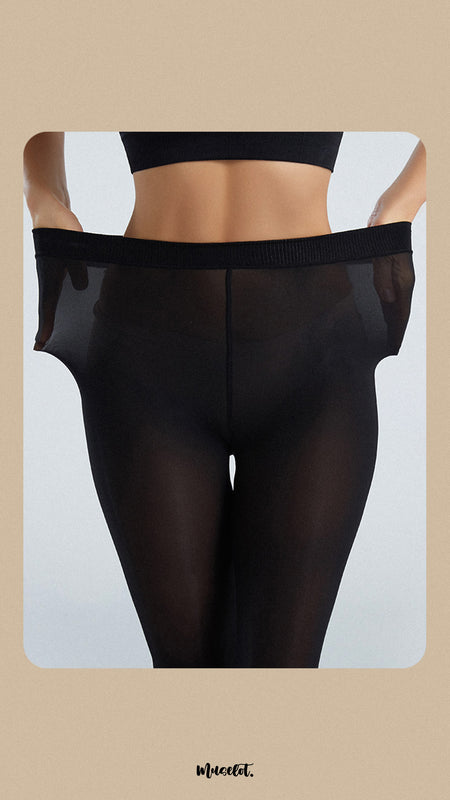 A model, wearing Silken Touch Premium Black Sheer Pantyhose, is stretching the waistband to showcase its flexible, comfortable fit. The sheer black fabric highlights a smooth, elegant look, perfect for adding sophistication and style to any outfit. -Muselot