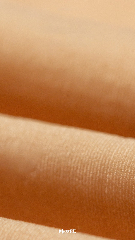 A zoom-in shot of the silken touch tights highlighting the quality of the tights and their fine weave, durability, and smooth silken texture-Muselot