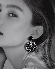 Close-up shot of a model wearing Siyahgul black earrings, where bold black tones and fine detailing create a statement look that balances elegance with contemporary flair — Muselot.