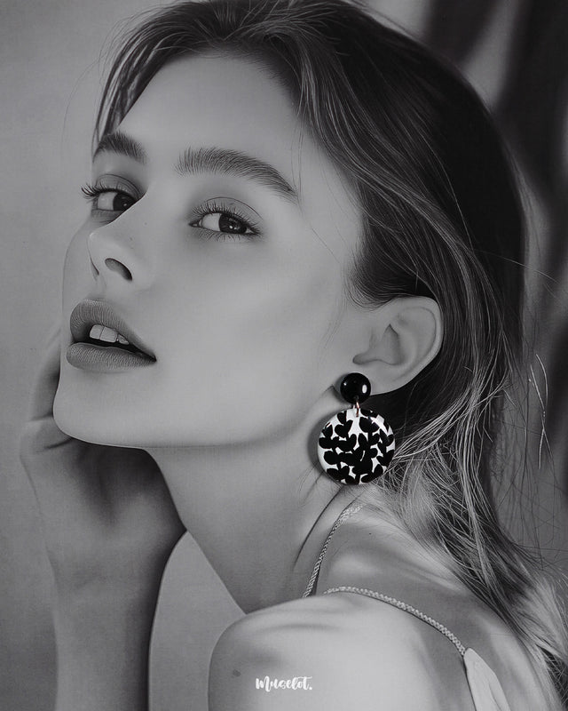 a model wearing Siyahgul black earrings, featuring a sleek silhouette and intricate design that exude bold sophistication and modern elegance — Muselot.