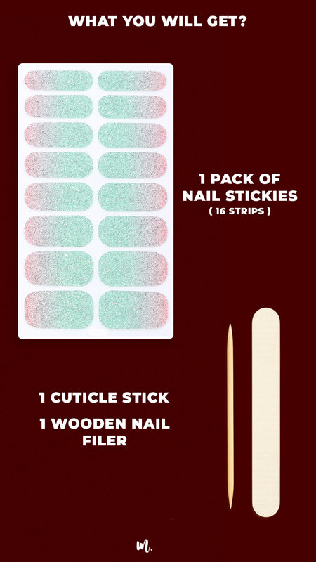 A flat lay of the Snow Petal Multicolor Ombre Nail Art Kit, showcasing the complete set with 16 ombre nail stickies in a blush-pink to mint-green gradient packed with silver glitter, alongside a wooden cuticle stick and a nail filer, highlighting the ready-to-use essentials for achieving a flawless ombre glitter manicure at home – Muselot.