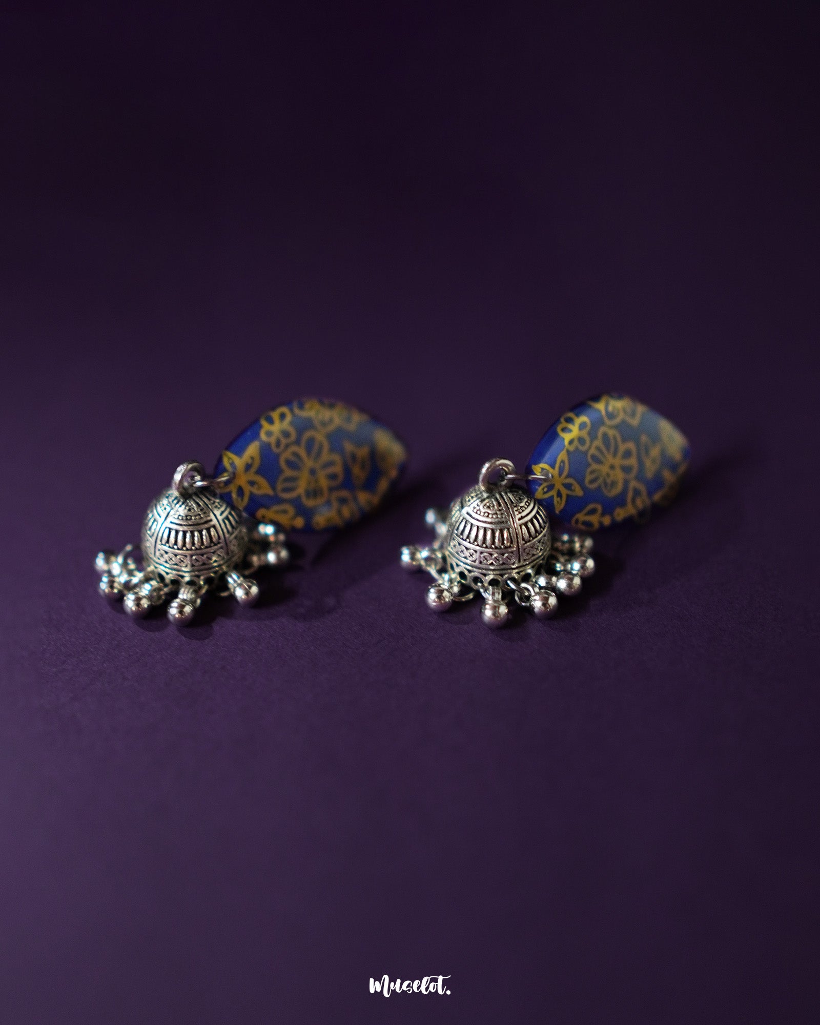 The Tabeer floral jhumkas feature a beautiful floral dome design with intricate detailing, adding a graceful and traditional touch to your look — Muselot.