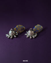 The Tabeer floral jhumkas feature a beautiful floral dome design with intricate detailing, adding a graceful and traditional touch to your look — Muselot.