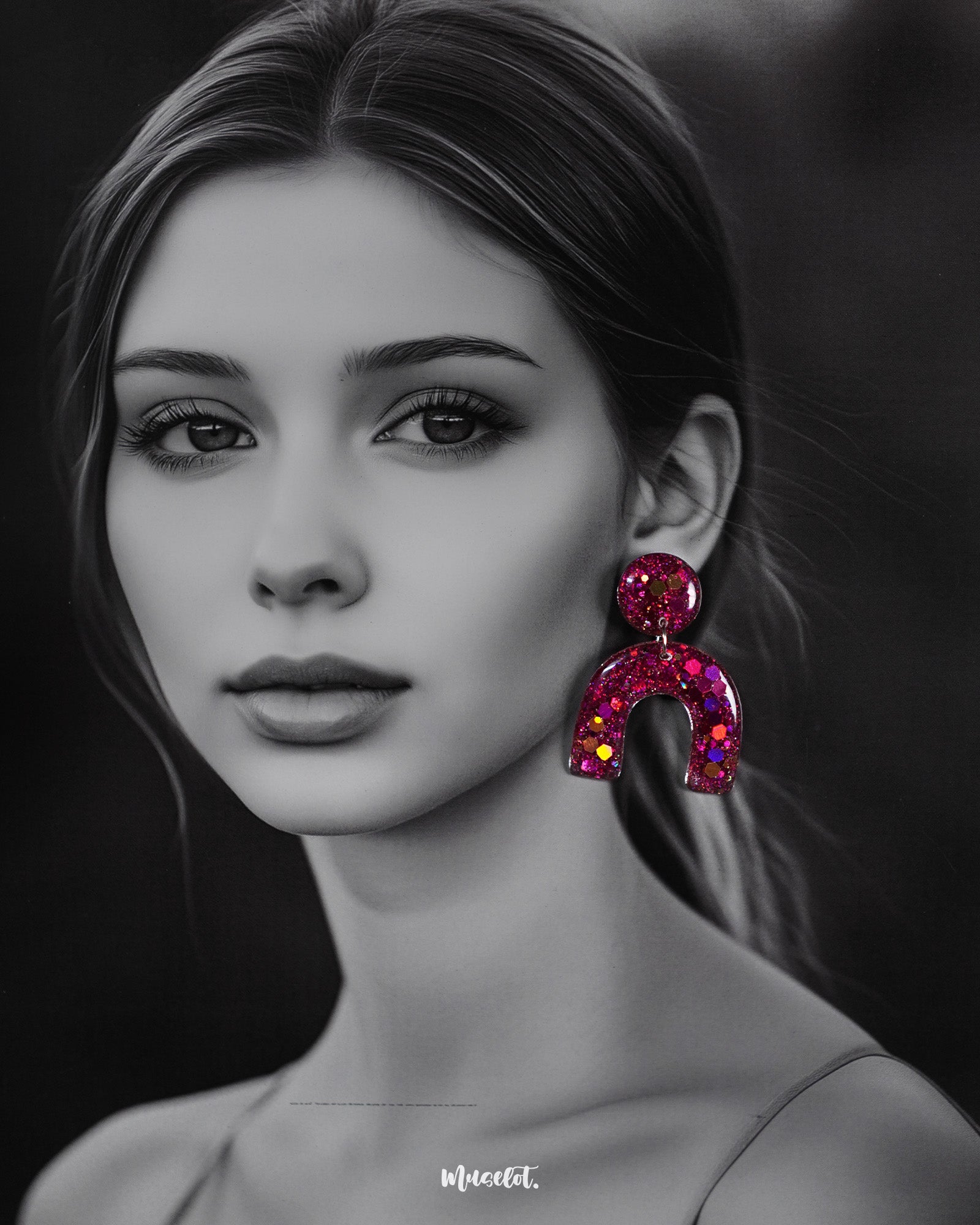 Model wearing Ulfat glitter resin stud earrings in bold pink-purple sparkle, styled to showcase their statement arch design and vibrant shine – Muselot.