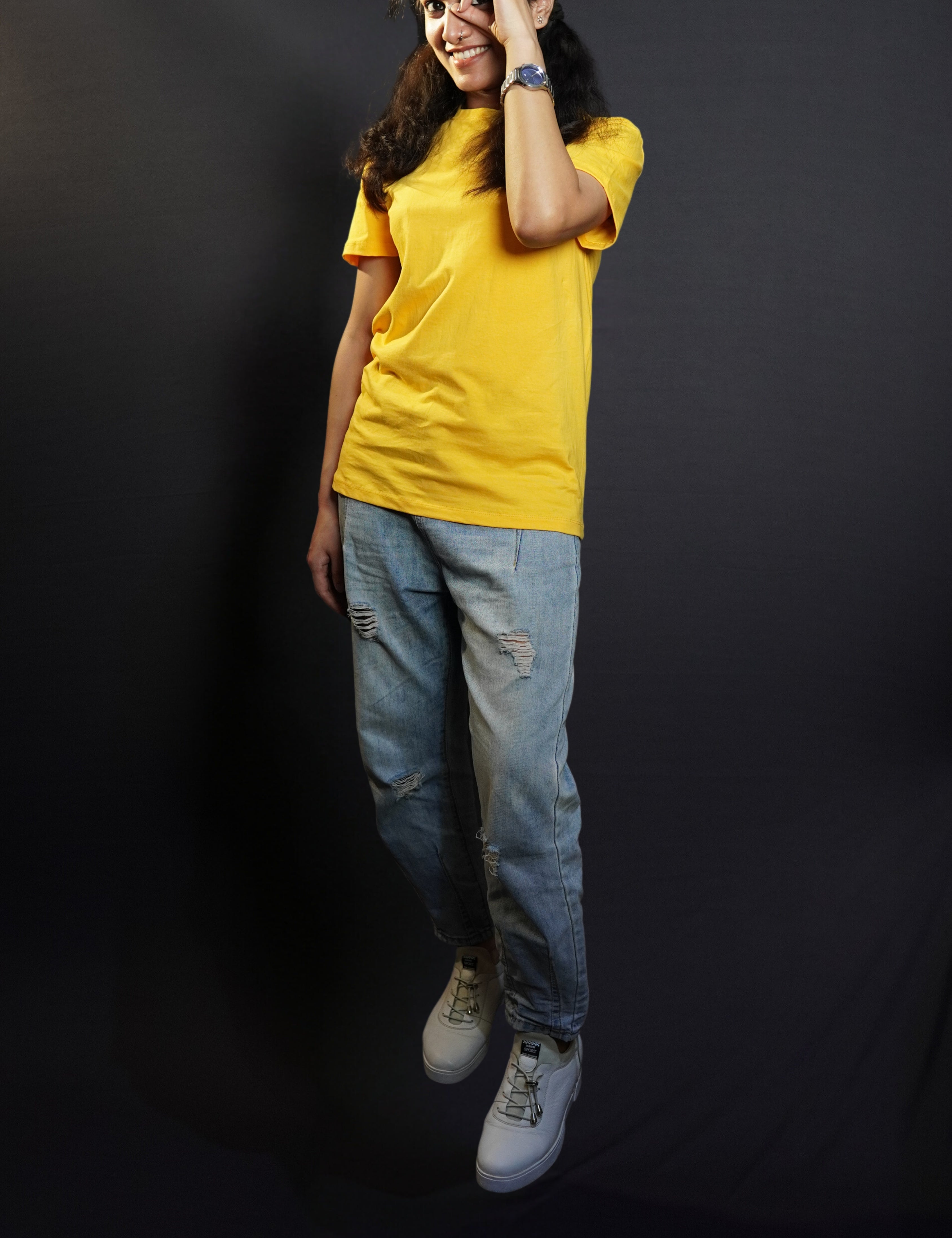A model wearing golden yellow T shirt posing happily_Muselot