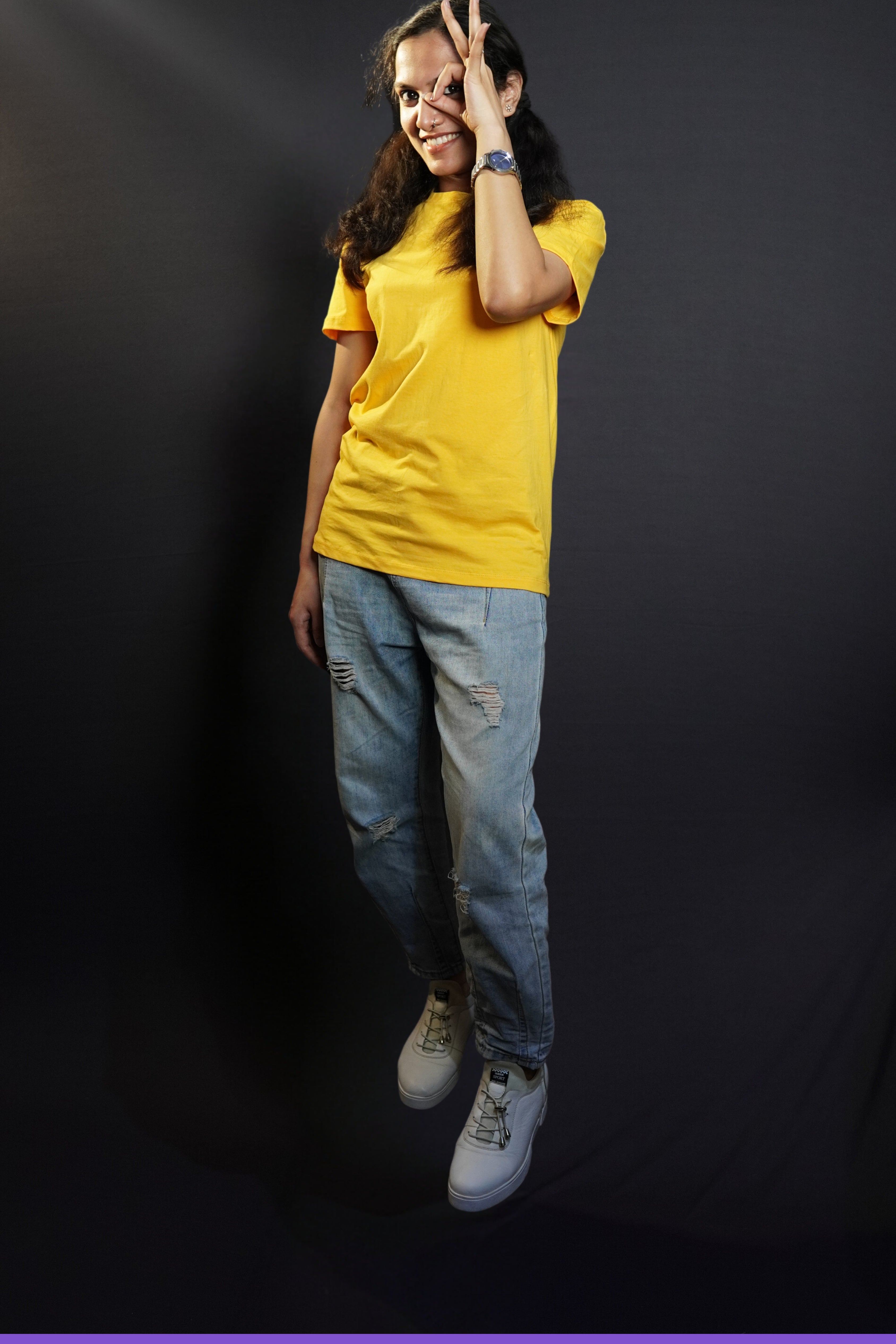 A model wearing golden yellow T shirt posing happily_Muselot