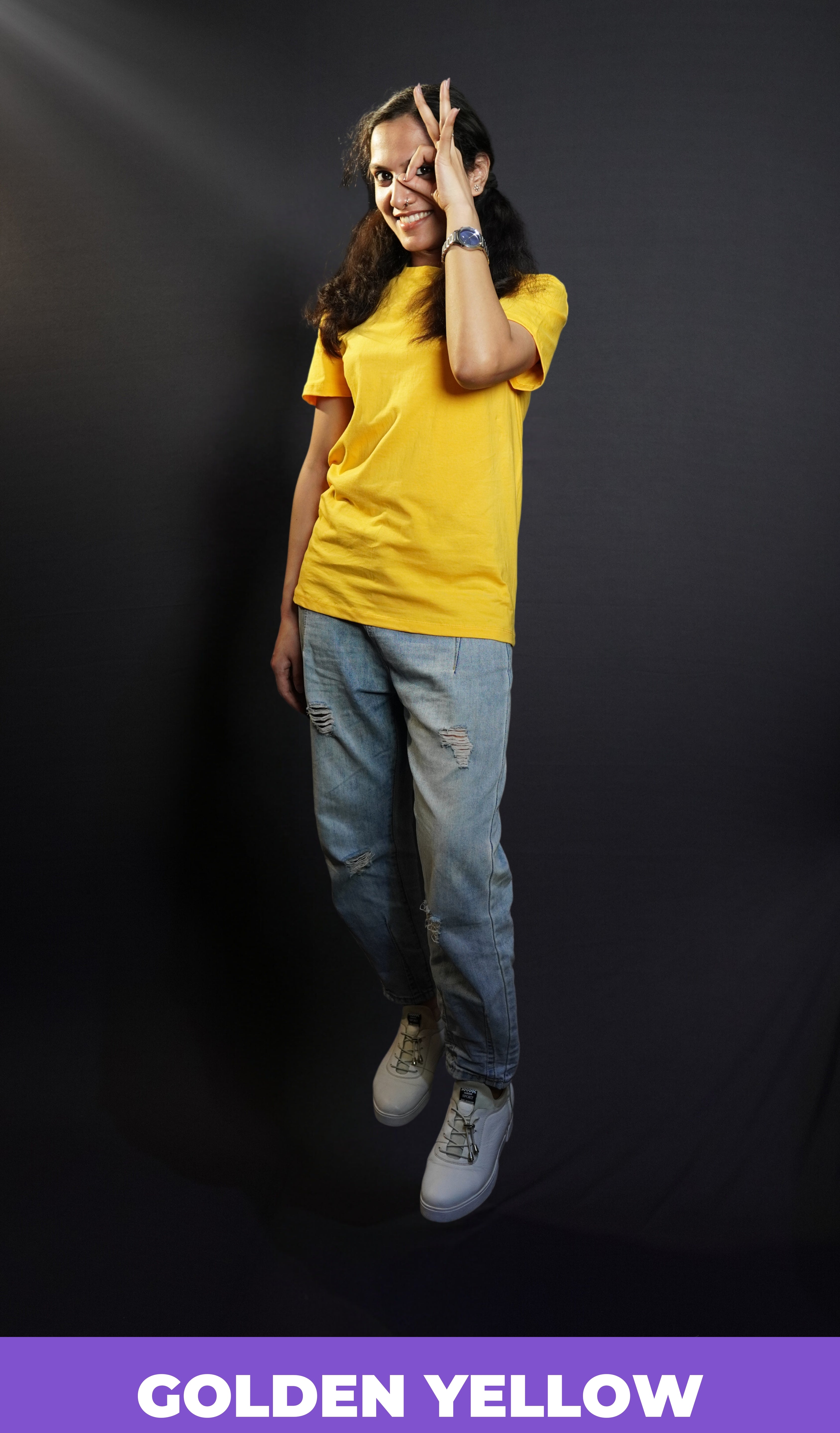 A model wearing golden yellow T shirt posing happily_Muselot