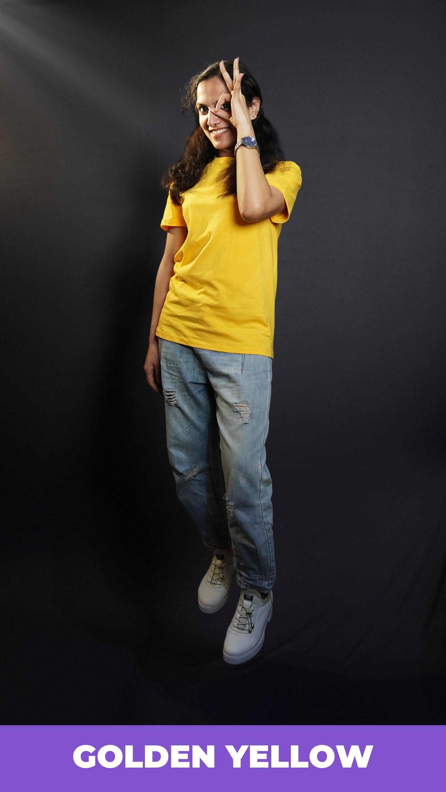 A model wearing golden yellow T shirt posing happily_Muselot