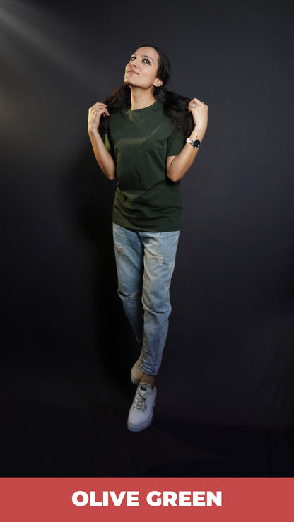 A woman wearing a plain round neck moisture wicking olive green t-shirt, posing with her hands pulling the sections of her hair, highlighting a fresh cozy look-Muselot