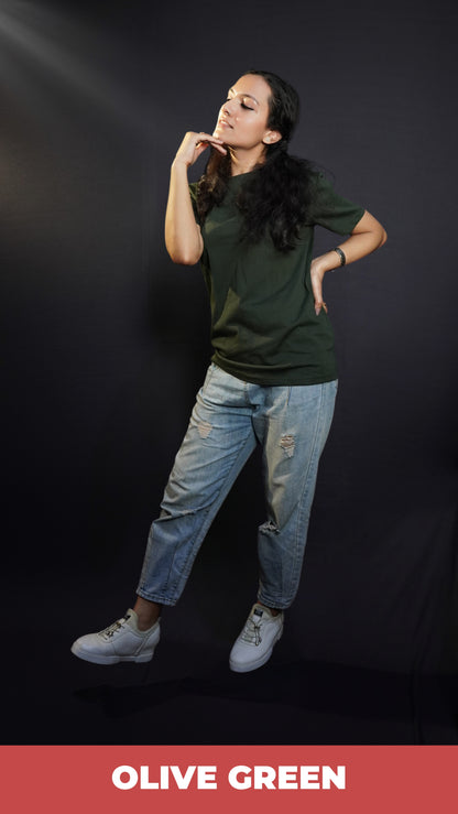 A woman posing with her hand under her chin and other on her waist, wearing a girl's plain stretchable round neck olive green t-shirt, showcasing a popular perfect fit-Muselot