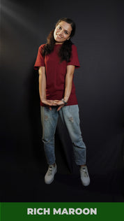 A woman wearing men's cotton short sleeved moisture wicking rich maroon t-shirt, posing with her hand stretched in front of her, highlighting a casual everyday fit-Muselot