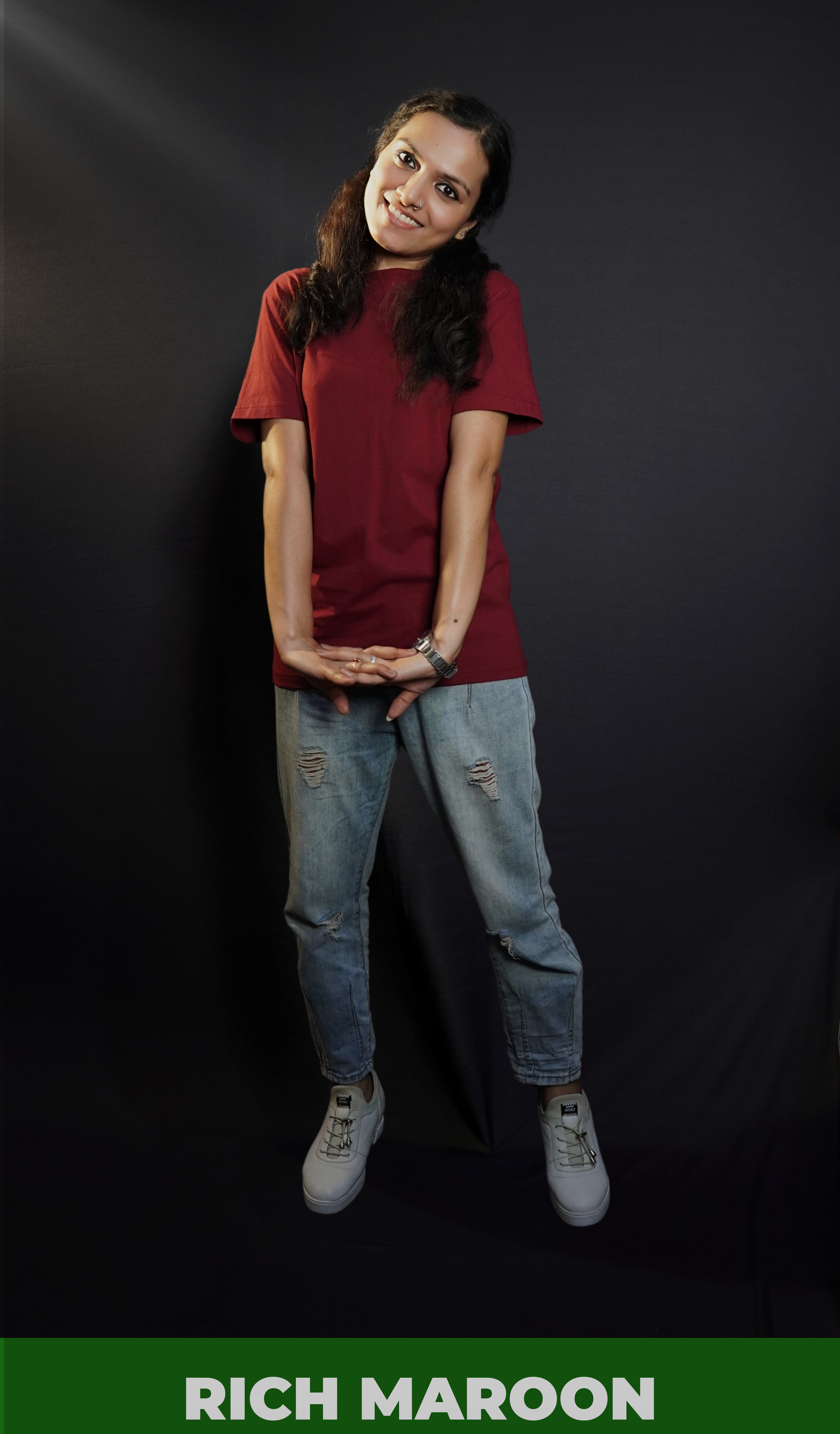 A woman wearing men's cotton short sleeved moisture wicking rich maroon t-shirt, posing with her hand stretched in front of her, highlighting a casual everyday fit-Muselot
