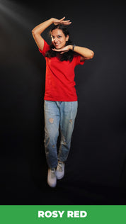 A woman wearing a girl's cotton short sleeved quick drying rosy red t-shirt, posing with her palms upon her head and under her chin, showcasing an informal snug fit-Muselot