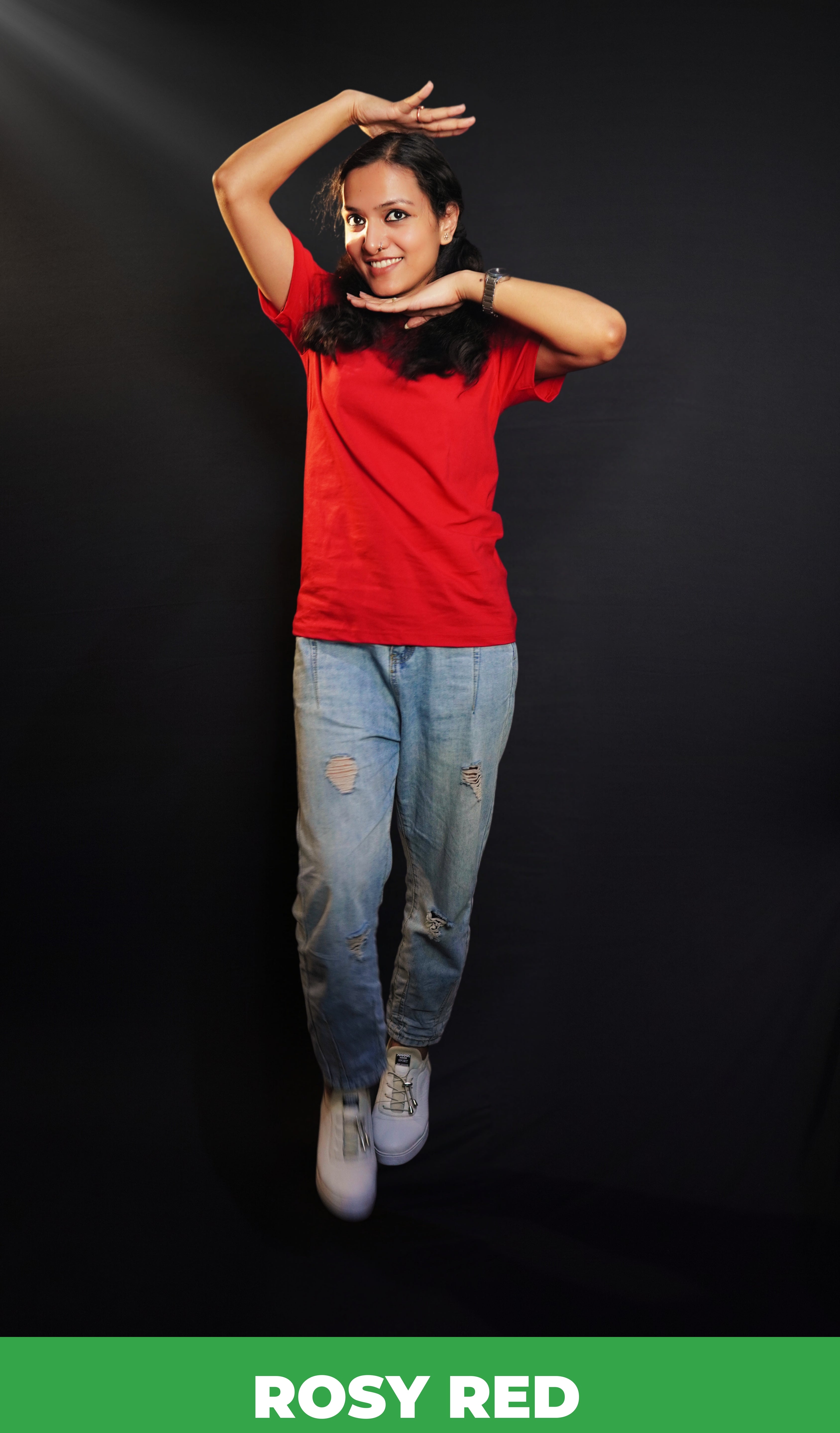 A woman wearing a girl's cotton short sleeved quick drying rosy red t-shirt, posing with her palms upon her head and under her chin, showcasing an informal snug fit-Muselot