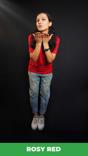 A woman wearing a plus size plain cotton stretchable t-shirt, posing as she offer a flying kiss with her palms stretched near her chin, showcasing a trendy baggy fit-Muselot