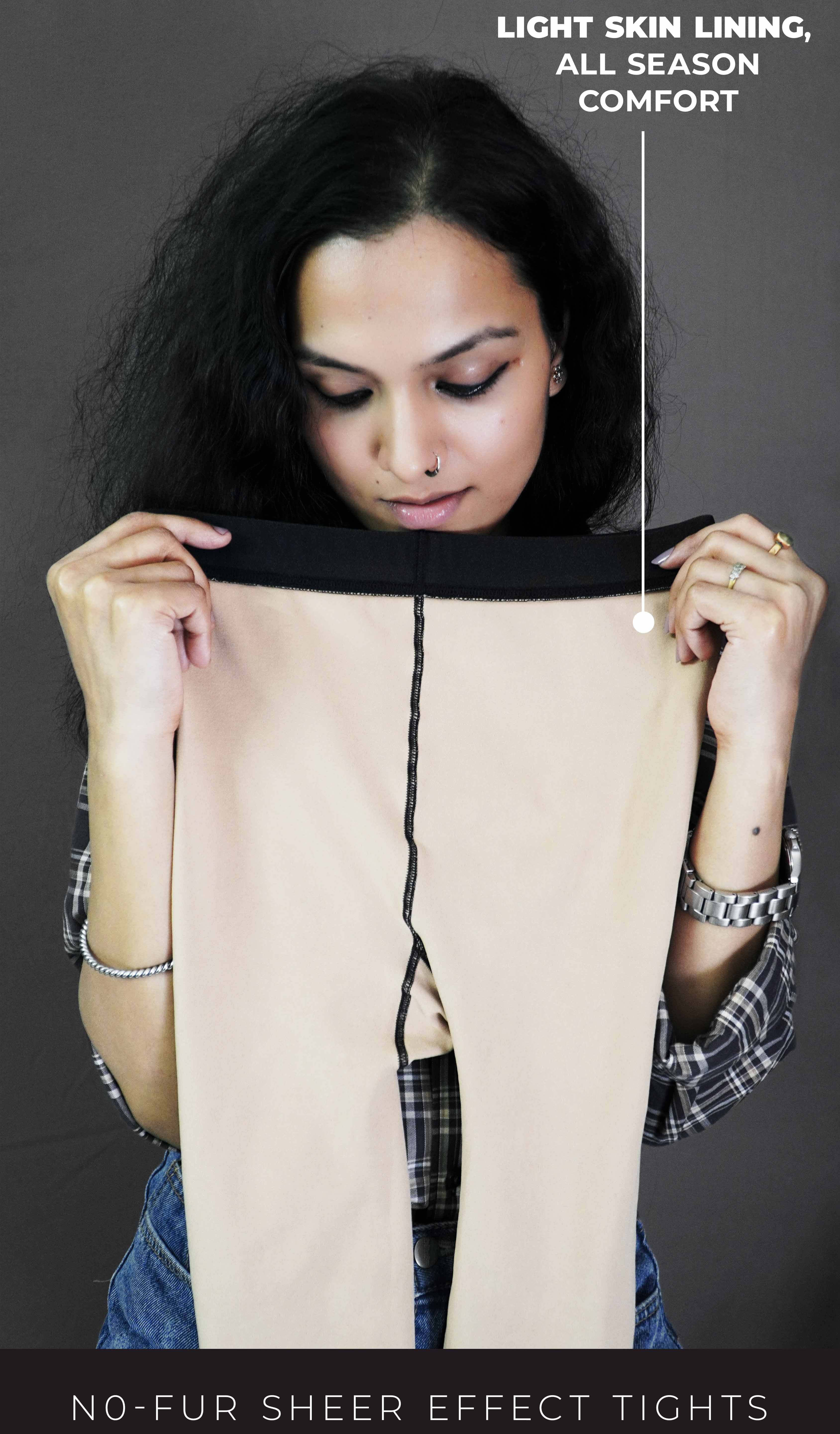 A model showcasing all-season skin-lined sheer tights, holding them inside out to highlight the soft and cozy skin lining. These versatile tights combine elegance with practicality, offering a sheer finish perfect for any outfit and season. -Muselot








