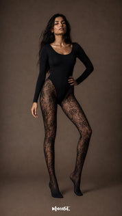 Full-length fashion view of black fishnet stockings for women featuring an intricate rose and leaf lace design from thigh to covered toe-Muselot