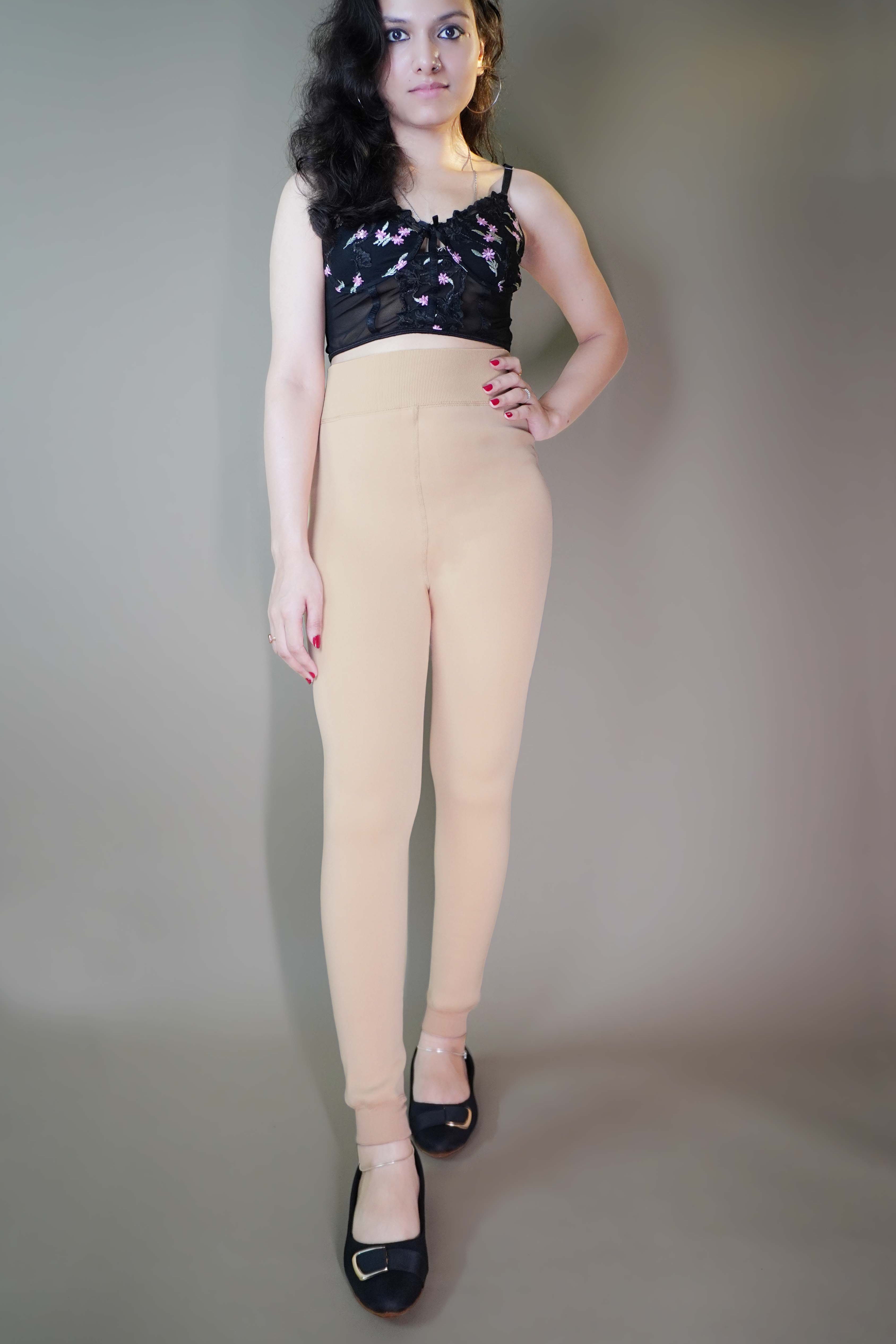 A model, wearing comfy fur-lined skin warm tights, highlighting their plush, insulating fabric that provides extra warmth and comfort. The skin tone adds a natural, seamless look, while the fur lining ensures a cozy, stylish fit. -Muselot