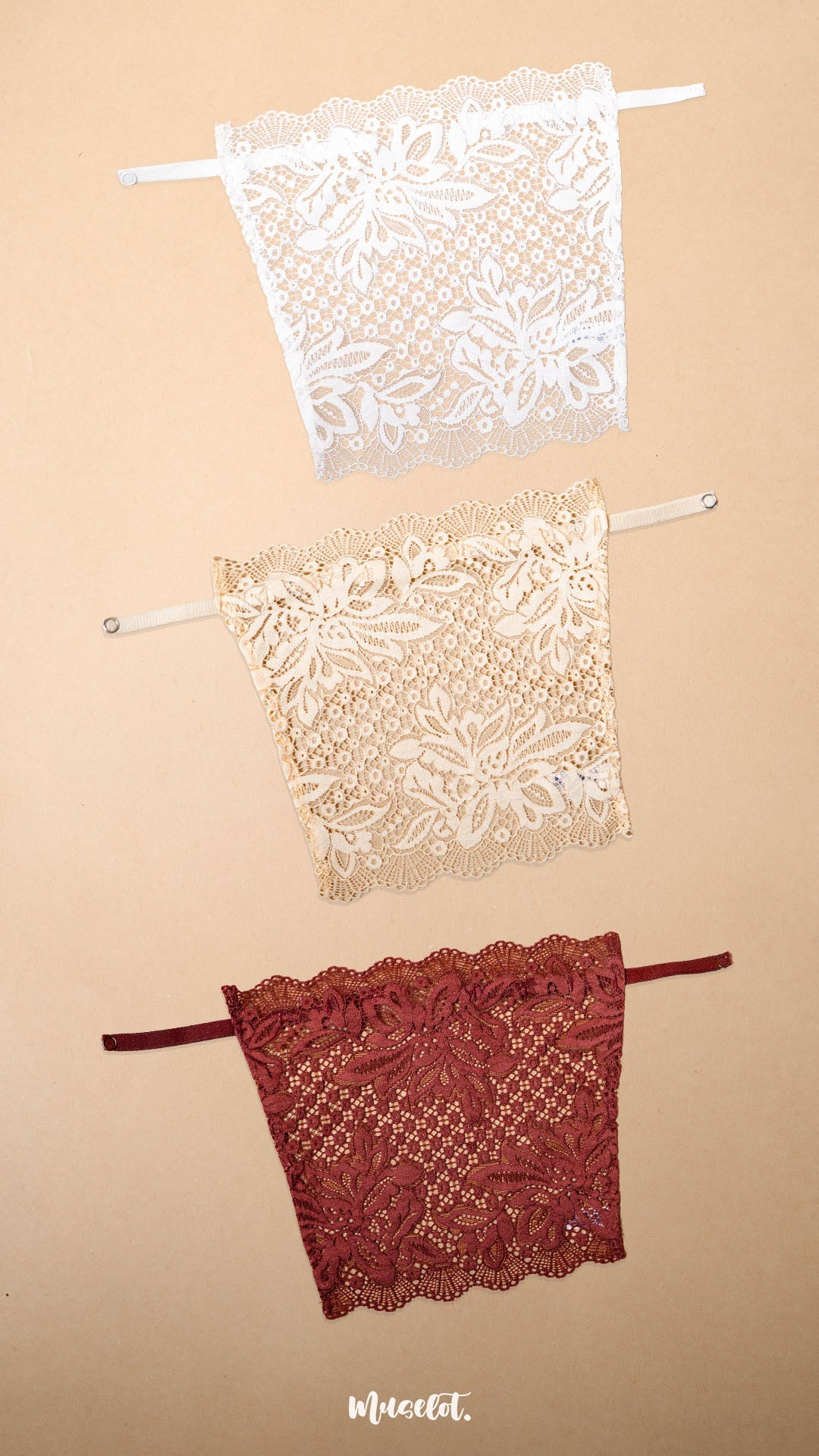 A pack of 3 deep neck cover-up displayed on a beige background, featuring white, beige and burgundy lace neckline inserts with premium floral lace detailing, adjustable straps and elegant modesty coverage for deep neck tops, blouses and dresses-Muselot