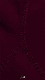 Close-up of double-stitched seam on maroon opaque tights, highlighting durability, reinforced strength, and premium craftsmanship - Muselot