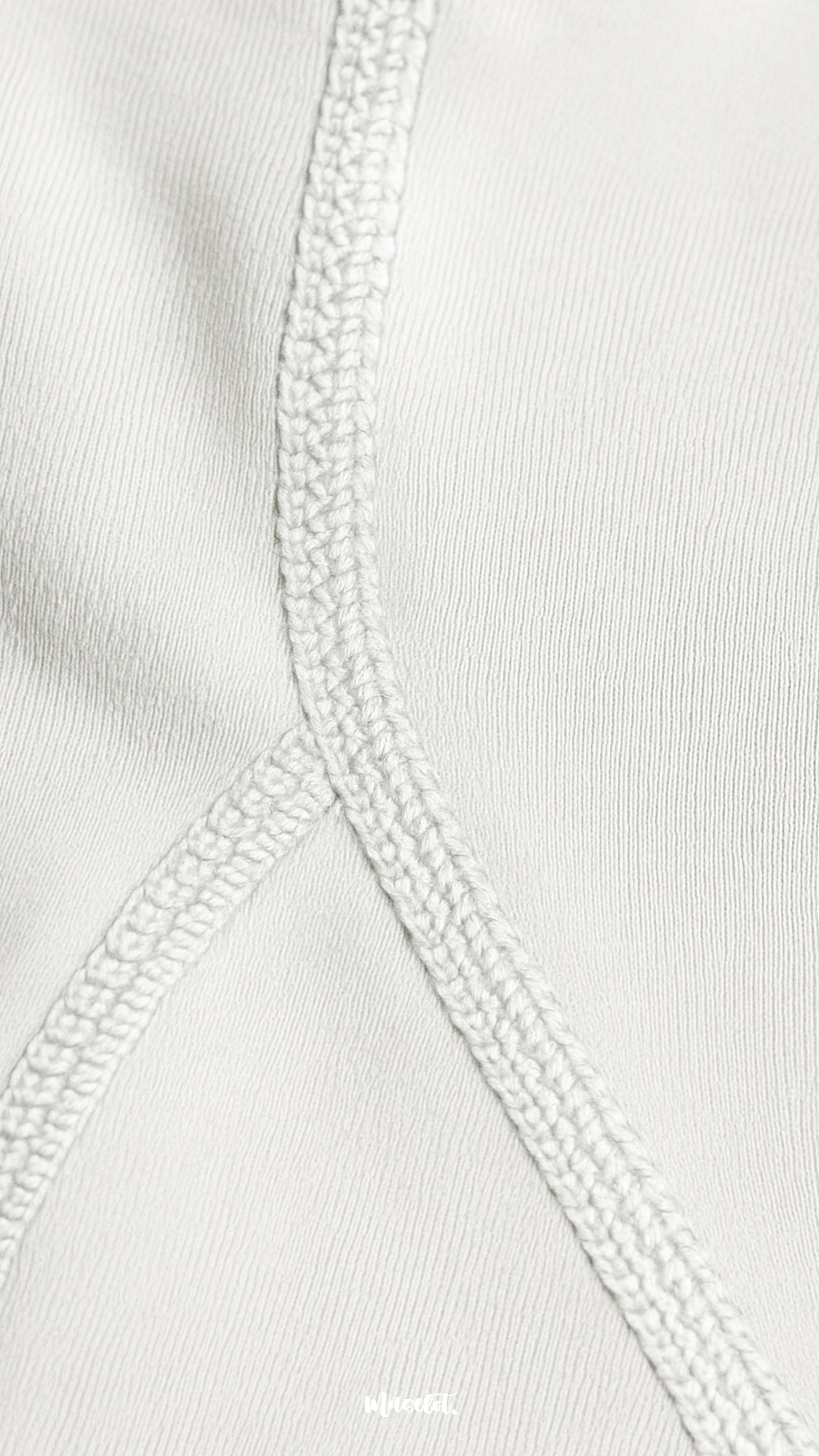 A close-up of double-stitched white opaque tights showing reinforced seams, durable finish, and premium quality craftsmanship - Muselot