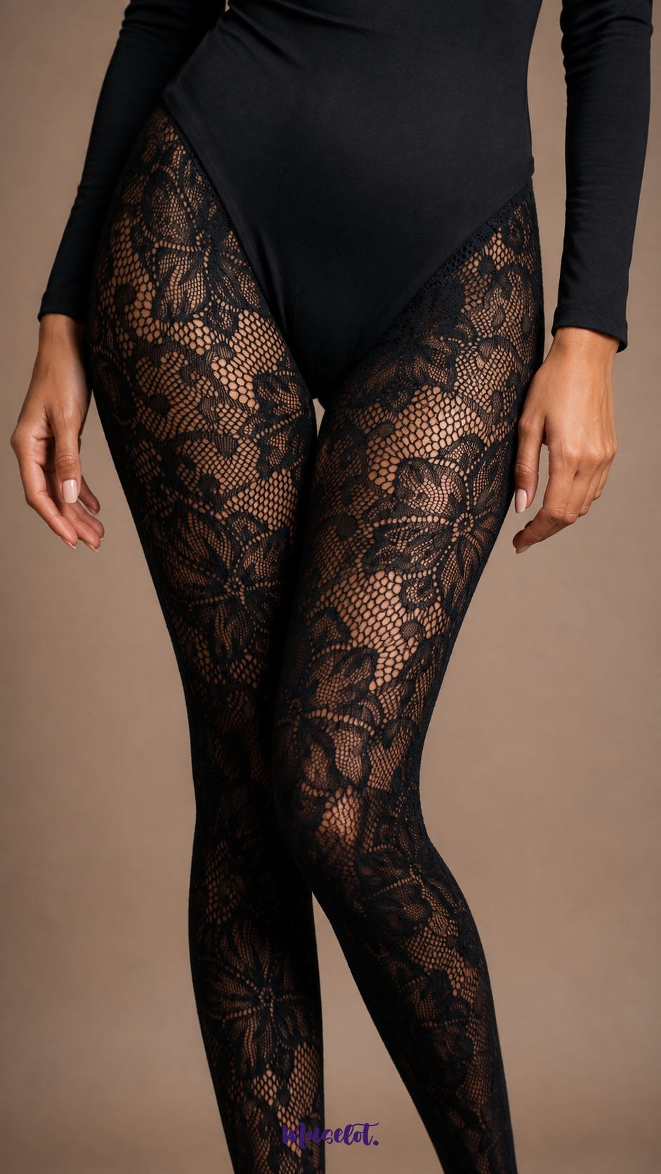 Close-up of black floral fishnet stockings highlighting detailed botanical lace motifs and open mesh texture across the thighs - Muselot