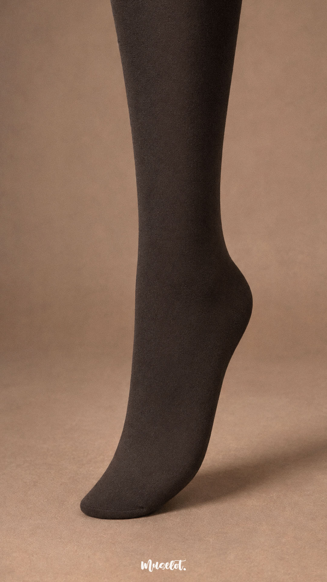 Close-up of dark brown fur lined winter stockings showing the fully covered closed-toe foot and smooth opaque thermal finish.