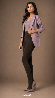Woman wearing dark brown fur lined winter stockings with closed feet, high waist and full-length warm opaque coverage.