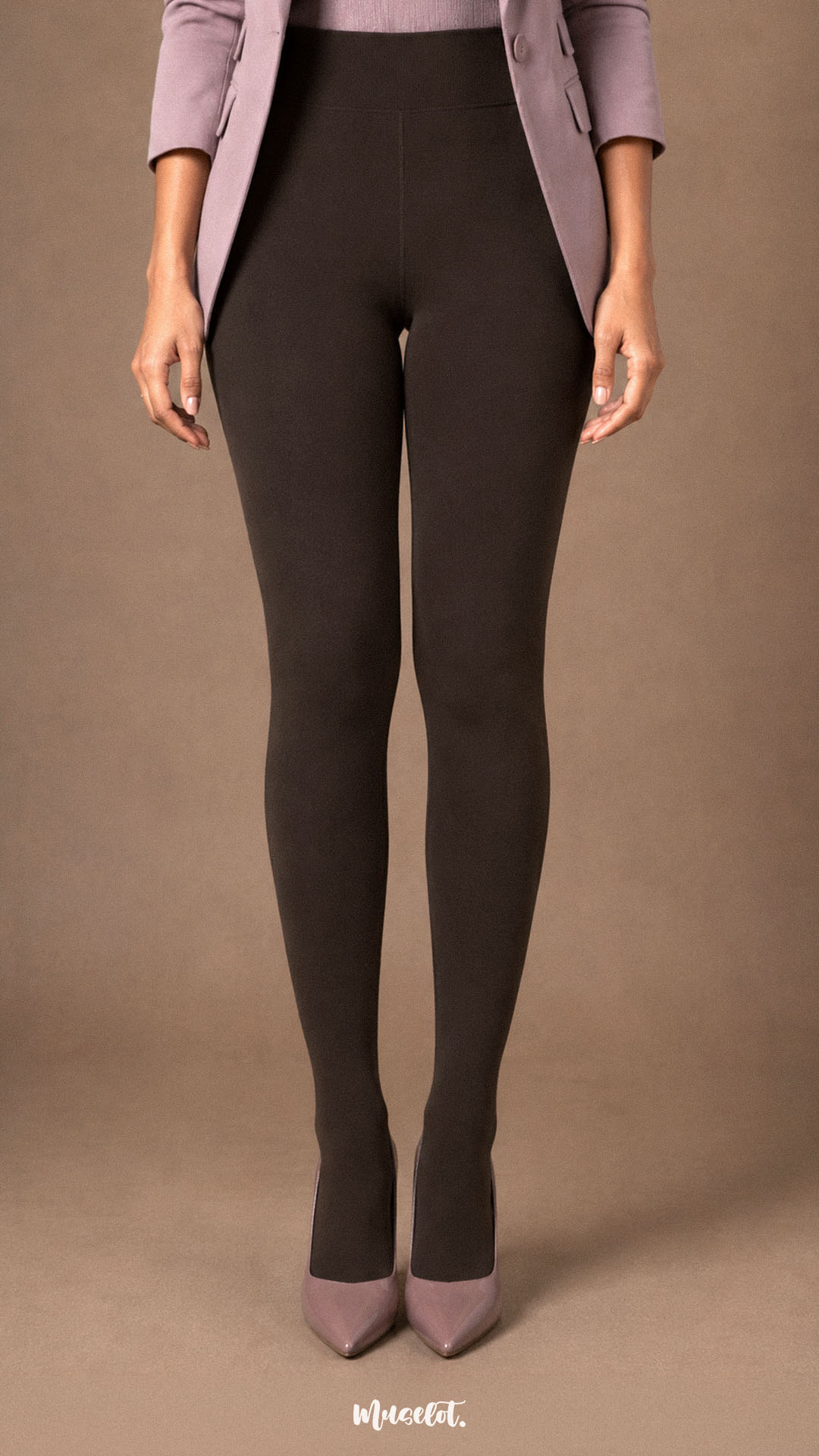 Front view of dark brown fur lined winter tights showing a smooth high-waist fit and fully covered feet worn with heels.