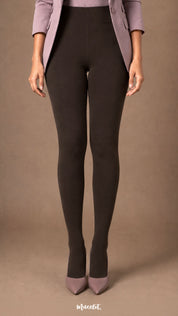 Front view of dark brown fur lined winter tights showing a smooth high-waist fit and fully covered feet worn with heels.