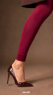 Close-up of maroon fur lined open-foot stockings showing the ribbed ankle cuff, smooth opaque finish and heel styling - Muselot