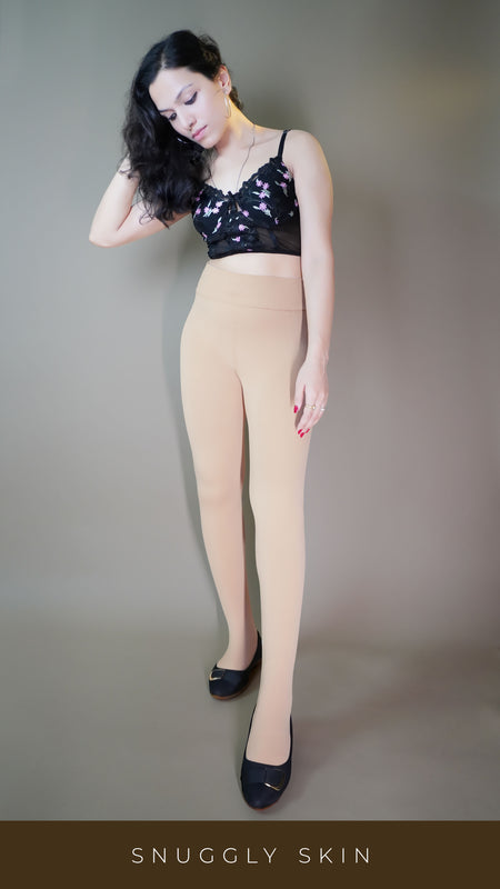 A model, wearing fur-lined skin warm stockings, showcasing their plush, insulating texture for added warmth. The skin color highlighting a natural, sleek design, making these stockings a cozy and stylish choice for colder weather. -Muselot